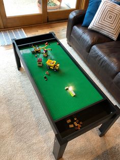 a coffee table that has legos on it