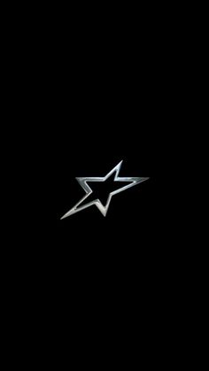 a black background with a silver star on it