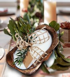 the table is set with candles, napkins and other decorative items for an elegant look