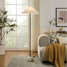 a living room scene with focus on the floor lamp