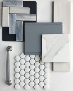 white and gray tile with different shapes and sizes on the wall next to each other