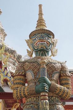 an elaborately decorated statue stands in front of a building