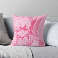 a pink pillow sitting on top of a couch