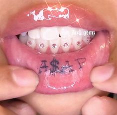 a close up of a child's mouth with writing on the tongue and teeth