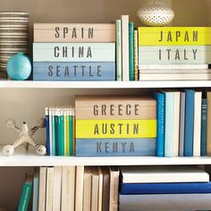 several books are stacked on top of each other in a bookcase with the words japan, china, seattle and greece