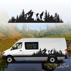 a van parked in the water with mountains and trees painted on it's side