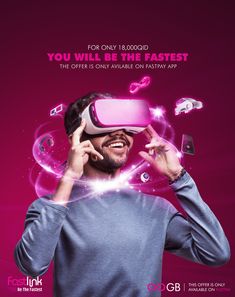 a man wearing a pink virtual headset and holding his hands up in front of his face