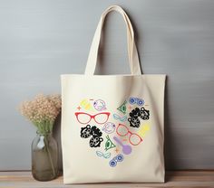 "Colorful Eye Heart Tote Bag | Optometry gift | Optician Ophthalmologist reusable tote bag | Ophthalmology technician gift bag Optometry tech This 100% cotton bag comes in one size - 15\" x 16\"- perfect for everyday wear. The bag features 20\" handles (made from the same canvas), making it easy to carry even with a week's worth of shopping. .: 100% cotton canvas .: Heavy fabric .: Sewn-in label .: Made to order" Ophthalmology Technician, Heart Tote Bag, Canvas Making, Cute Tote Bags, Tote Bag Design, Cotton Bag, Heavy Fabric, Gift Bag, Reusable Tote