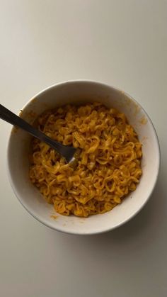 a white bowl filled with macaroni and cheese