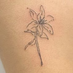 a flower tattoo on the back of a woman