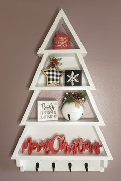 a christmas tree shelf with ornaments on it