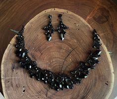 These fun and stylish black teardrop cluster crystal rhinestone necklace and earrings set are a great statement piece!  Size of earrings: 2" Long.  Necklace 15"long with 3" chain extender Decor Size: 1.25" Color: black rhinestone Base metal color: black More colors available upon request, just message us! Need a matching bracelet? https://www.etsy.com/listing/586175183/black-rhinestone-bracelet-black-crystal?ref=shop_home_active_6 https://www.etsy.com/listing/550147426/black-rhinestone-bracelet- Black Rhinestone Necklace, Black Teardrop Rhinestone Jewelry, Black Teardrop Jewelry With Rhinestones, Black Teardrop Crystal Jewelry, Black Jewelry Sets For Party, Glamorous Black Rhinestone Necklace For Evening, Black Rhinestone Necklace For Wedding, Glamorous Black Rhinestone Crystal Necklace, Black Crystal Rhinestone Necklace For Wedding