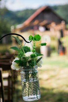 a vase filled with flowers sitting on top of a table