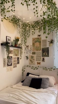 the bedroom is decorated in white and has plants growing on the wall above the bed