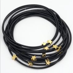 New Stack Of Black Gold Star Studded Piano Wire 12 Strand Bracelet Set. The Bracelet Comes As A 12 Strand Set Featuring Actual Stainless Steel Piano Wire And Star Stud Accents. Layer These Bracelets Or Wear Apart. Silver Pandora Charms, Hope Bracelet, Tennis Jewelry, Chanel Bracelet, Vintage Bangle Bracelets, Wire Wrapped Bangles, Orange Bracelet, Vintage Bangles, Bangle Bracelets With Charms