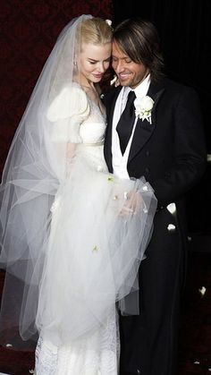 a man in a tuxedo and a woman in a wedding dress