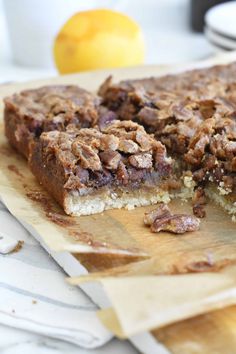 a piece of cake sitting on top of a wooden cutting board