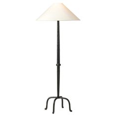 a floor lamp with a white shade on the top and black metal base, against a white background