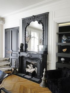 the living room is decorated in black and white