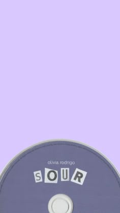 a cd with the word sour on it in front of a purple and white background