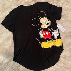 Women’s Mickey And Minnie Disney Shirt. Perfect For Disneyland. The Front Has Mickey And The Back Minnie. Soft Loose Fitting Comfortable Shirt. Brand New. Various Sizes Black Cartoon Print Shirt For Disney Fan Events, Black Shirt With Cartoon Print For Disney Fan Events, Black Tops With Cartoon Print For Disney Fan Events, Black Shirt With Character Print For Disney Fan Events, Black Disney Tops With Cartoon Print For Fan Events, Black Graphic Print Tops For Disney Fan Events, Casual Short Sleeve Shirt With Minnie Mouse, Casual Black Shirt For Disney Trips, Black Mickey Mouse Tops For Disney Events