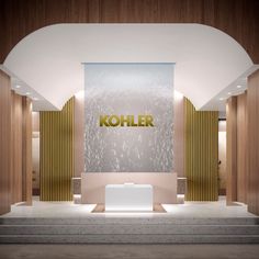 the entrance to kohler's new store is lit up with gold lettering