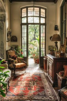 a living room filled with furniture and lots of windows next to a doorway that leads to a patio