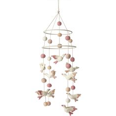 a mobile with birds and balls hanging from it's sides on a white background