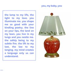 a red lamp sitting on top of a table next to a poem