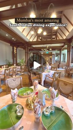 an image of a restaurant setting with green plates and silverware on the table in front of it