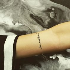 a woman's arm with a tattoo that reads, i love you