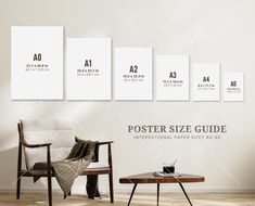 the poster size guide is displayed in front of a chair and table with a laptop on it