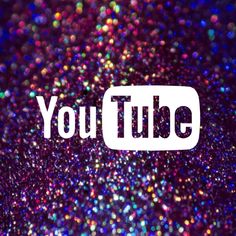 the youtube logo is displayed on a purple background with colorful lights and sparkles around it