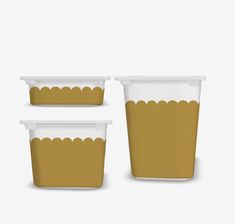 three plastic containers with scalloped edges and lids, one brown the other white