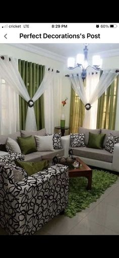 a living room filled with furniture and curtains