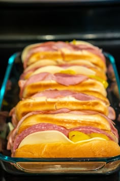 a glass baking dish filled with ham and cheese