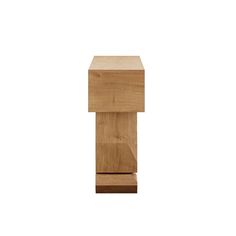 a small wooden object sitting on top of a white surface