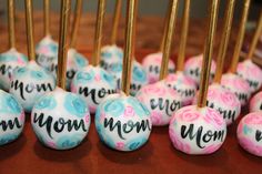 there are many cake pops with the word mom on them