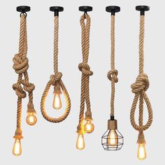 several different types of light bulbs hanging from ropes with lights attached to the ends of them