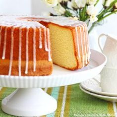 a bundt cake with icing sitting on a plate