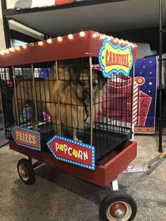 a dog in a cage with lights on it's sides and the words popcorn written on its side