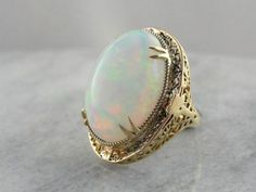 Vintage 14k Stamped Opal Ring For Formal Occasions, Classic Cabochon Opal Ring For Formal Occasions, Heirloom Oval Opal Ring For Formal Occasions, Classic Opal Ring Collectible, Vintage Hallmarked Opal Ring For Anniversary, Vintage Opal Gemstone Ring For Wedding, Classic Oval Opal Ring Collectible, Vintage Opal Ring For Wedding, Vintage 14k Gold Opal Ring