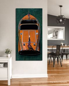 an orange and black car is on display in the living room