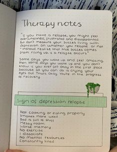 a hand holding an open book with writing on it and the words therapy notes written in green