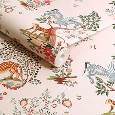 the wallpaper is decorated with animals and flowers on pink background, as well as an animal - themed design