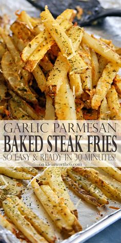 garlic parmesan baked steak fries on a baking sheet with text overlay that reads garlic parmesan baked steak fries so easy and ready in 30 minutes