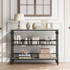 a shelf with books and other items on it in front of a wall mounted mirror