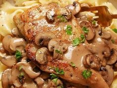 chicken with mushrooms and noodles on a plate, ready to be eaten in the oven