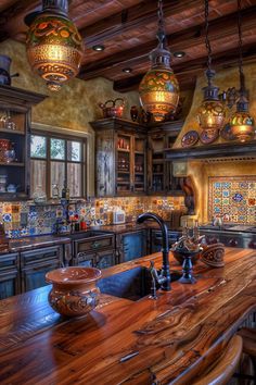 a kitchen with wooden counter tops and lots of lights hanging from the ceiling above it