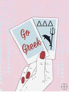 a hand holding two cards that say go greek